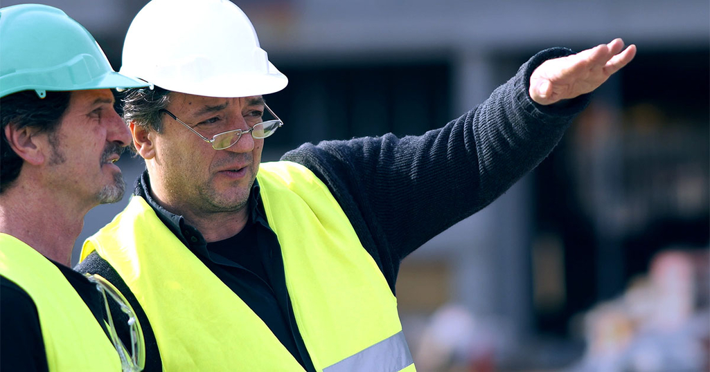 Construction workers discussing a building project